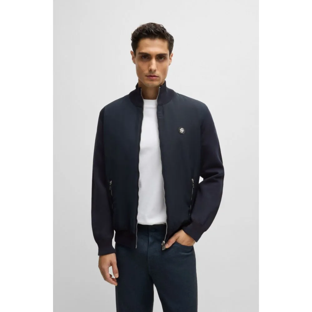 Mixed-material zip-up jacket with double-monogram badge